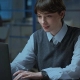 A businesswoman working on the laptop in the office